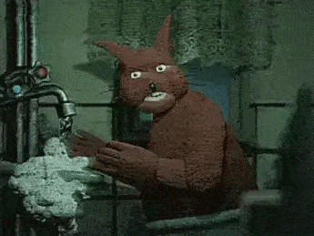 cartoon stop motion squirrel washing her hands in a dark bathroom
